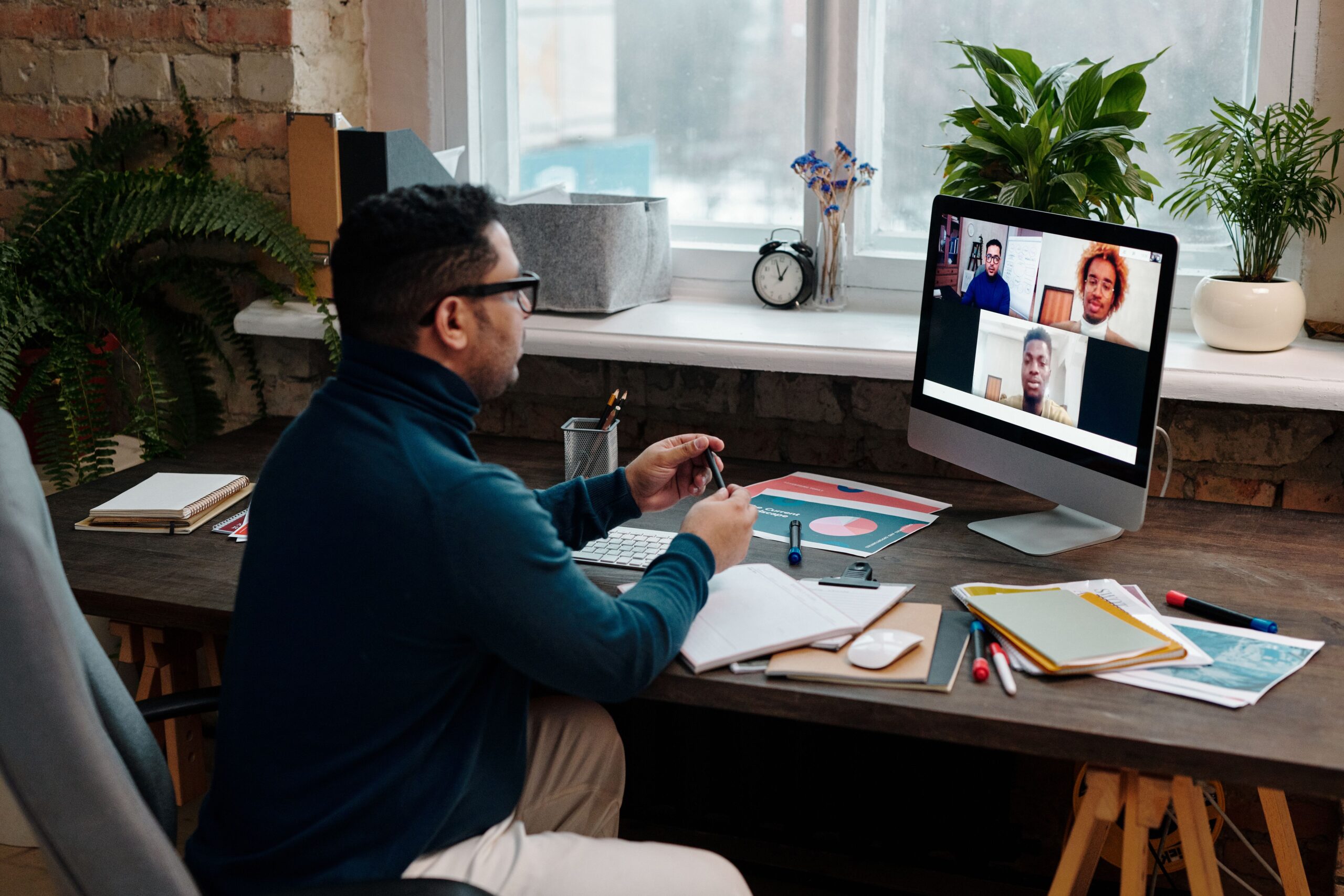 Teacher-Video-Calling-With-His-Students-Using-A-Computer